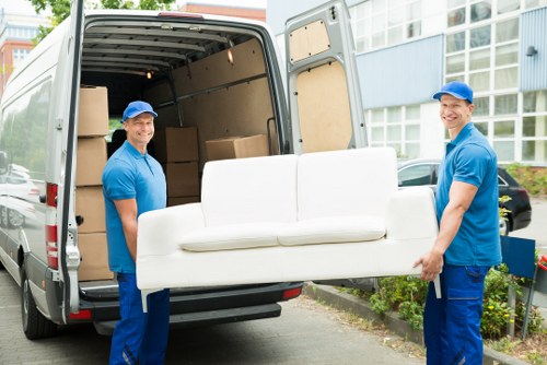 Moving boxes and furniture prepared for a UK house removal