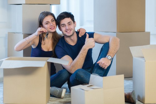 Professional furniture removals in UK with moving van and wrapped sofa