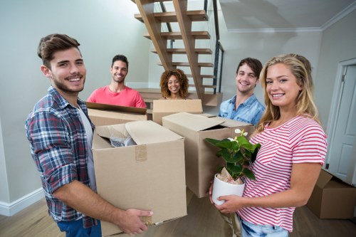 Removals team sorting recyclable packing materials during a sustainable move