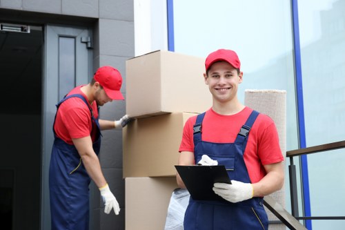 Moving van loading boxes outside a residential property for a removals quote