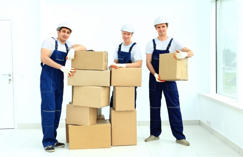 Professional man and van movers loading household items