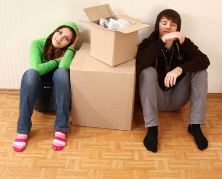 Specialist movers assessing access for piano removals in a UK property