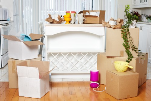 Professional movers handling furniture and boxes during a UK move