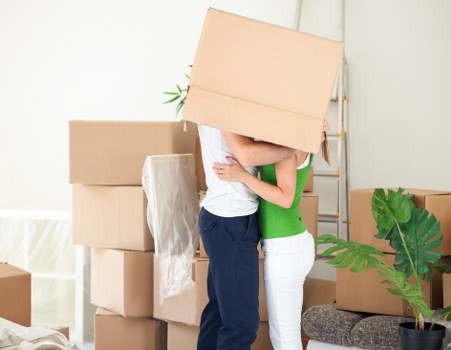 House moving boxes and furniture prepared for removals in the UK