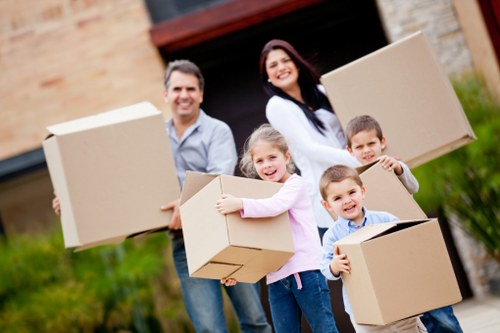 Professional movers loading furniture during a house move