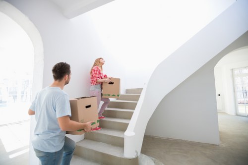 Packing materials including bubble wrap and tape beside boxes