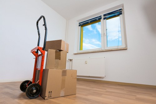 Piano movers loading an instrument into a secure transport vehicle