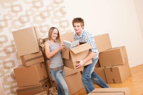 Moving van outside a city flat with packed furniture