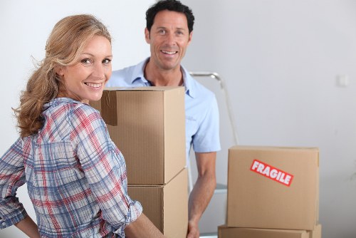 Professional movers handling household belongings carefully