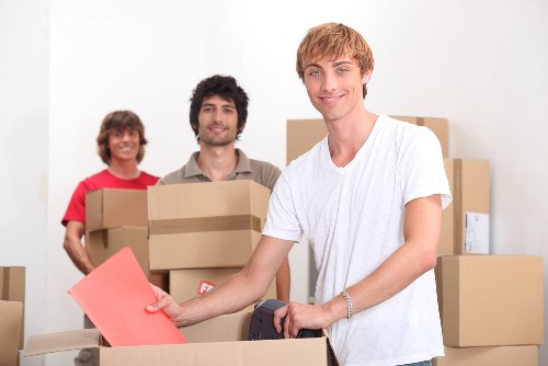 Office furniture removals in UK with desks and chairs being relocated